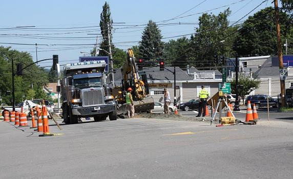 July 30, 2012 - Workers from the Russo construction company are widening the Grove Street intersection at Colella's parking lot.© Dick Bartlett