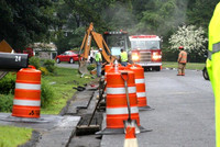 July 8, 2011 - A crew working in front of 22 Thayer Heights Road struck a gas main, causing it to leak. Firefighters stood by until repairs were made.© Dick Bartlett