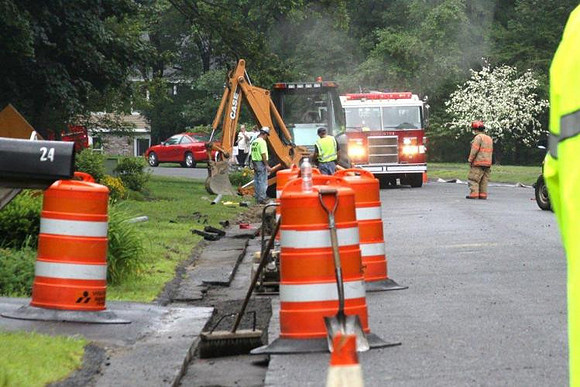 July 8, 2011 - A crew working in front of 22 Thayer Heights Road struck a gas main, causing it to leak. Firefighters stood by until repairs were made.© Dick Bartlett