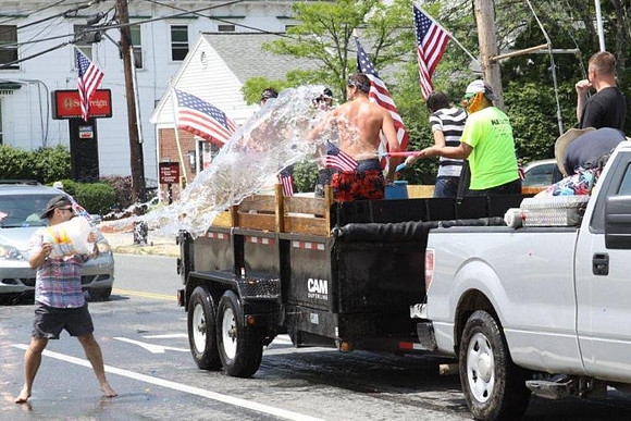 July 4, 2011 - An old fashoned water fight in front of Colella's during the Horrible's parade.© Dick Bartlett