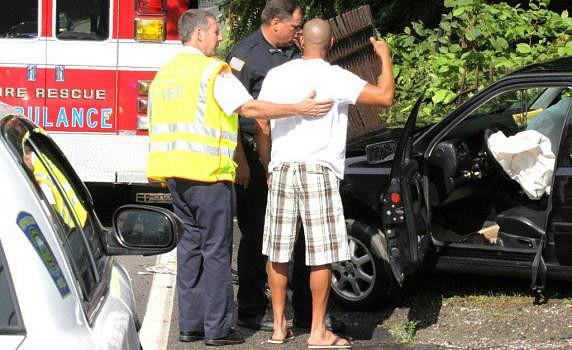 July 24, 2012 - No one was injured when this car struck a mail box and guard rail at 32 East Main Street.© Dick Bartlett