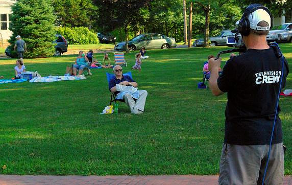 July 25, 2011 - Producer John Ritz captures some crowd shots as part of the Concerts on the Common Series that he produces for HCAM-TV. More photos at Scene in Hopkinton.© Mike Torosian
