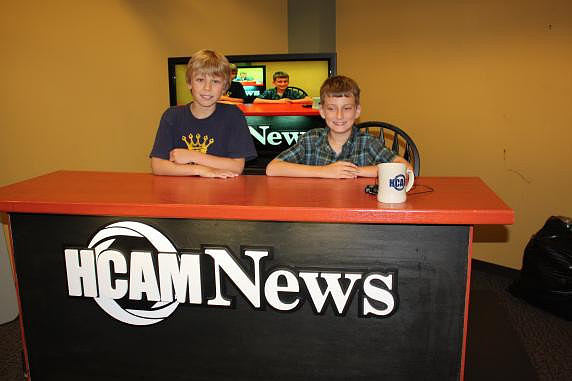 July 27, 2011 - Students in ESL's Script to Screen workshop enjoy sitting at the HCAM News Desk during their program held in the HCAM Studio.© Michelle Murdock