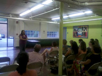 July 19, 2011 - Yei Kue, the second finalist being considered for Center School Principal speaks at the public forum in the Center School cafeteria.© Michelle Murdock