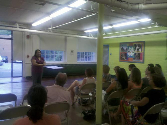 July 19, 2011 - Yei Kue, the second finalist being considered for Center School Principal speaks at the public forum in the Center School cafeteria.© Michelle Murdock