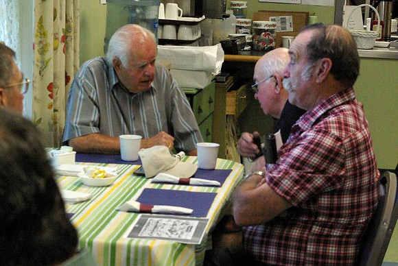 July 1, 2011 - Veteran Bob Lavoie shares a story at the Veteran Breakfast, which is held on the first Friday of every month at the Senior Center. © Mike Torosian